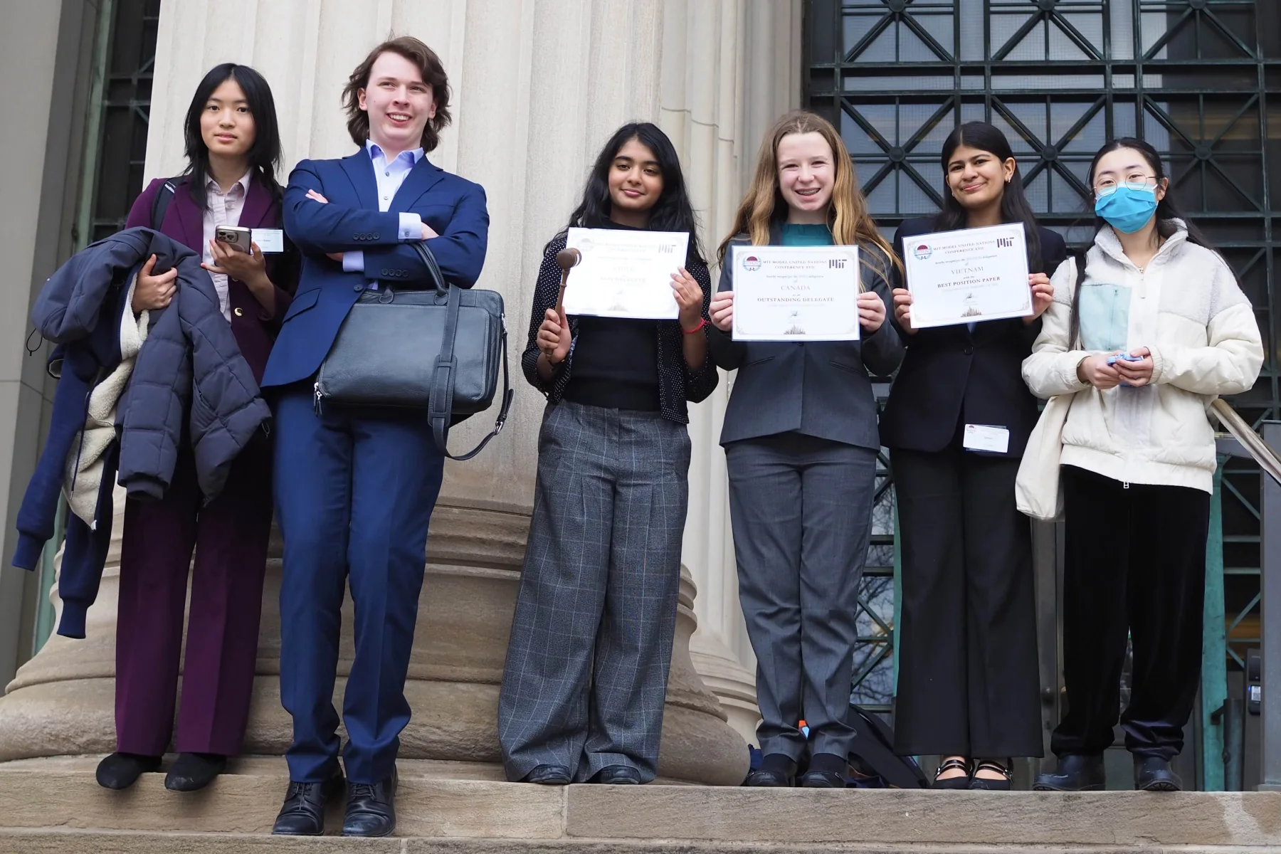 A complete MUNSDG awards group standing together outside a Model UN conference