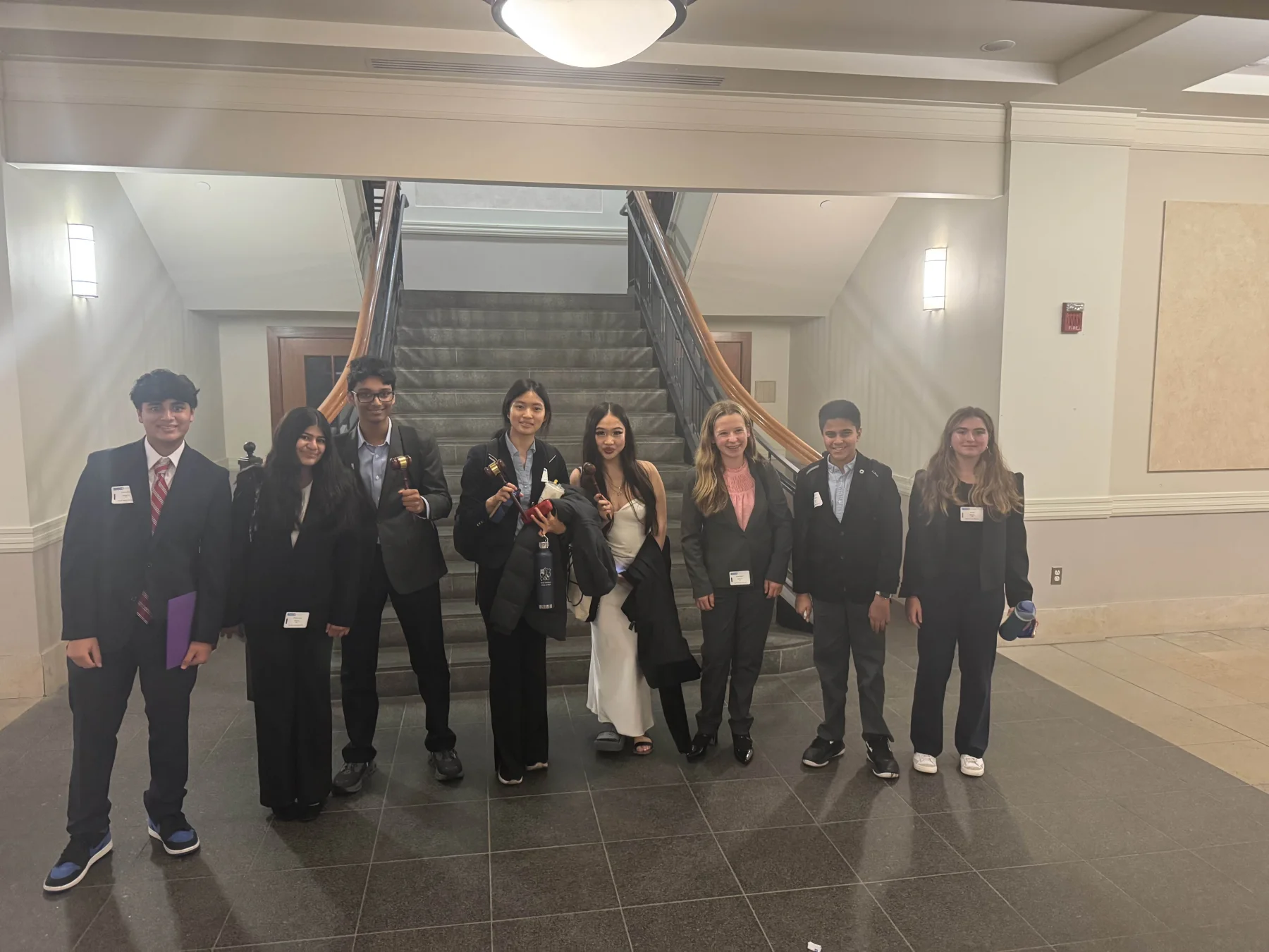 MUNSDG delegates standing together in professional conference attire